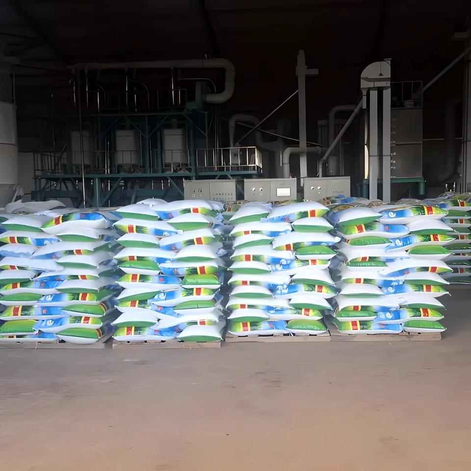 Pallets of Bazano Farming maize meal bags in front of the mill